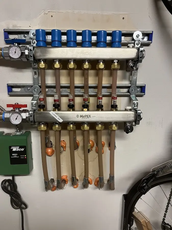 Plumber performing Gas Leak Detection at a residential property in Woonsocket